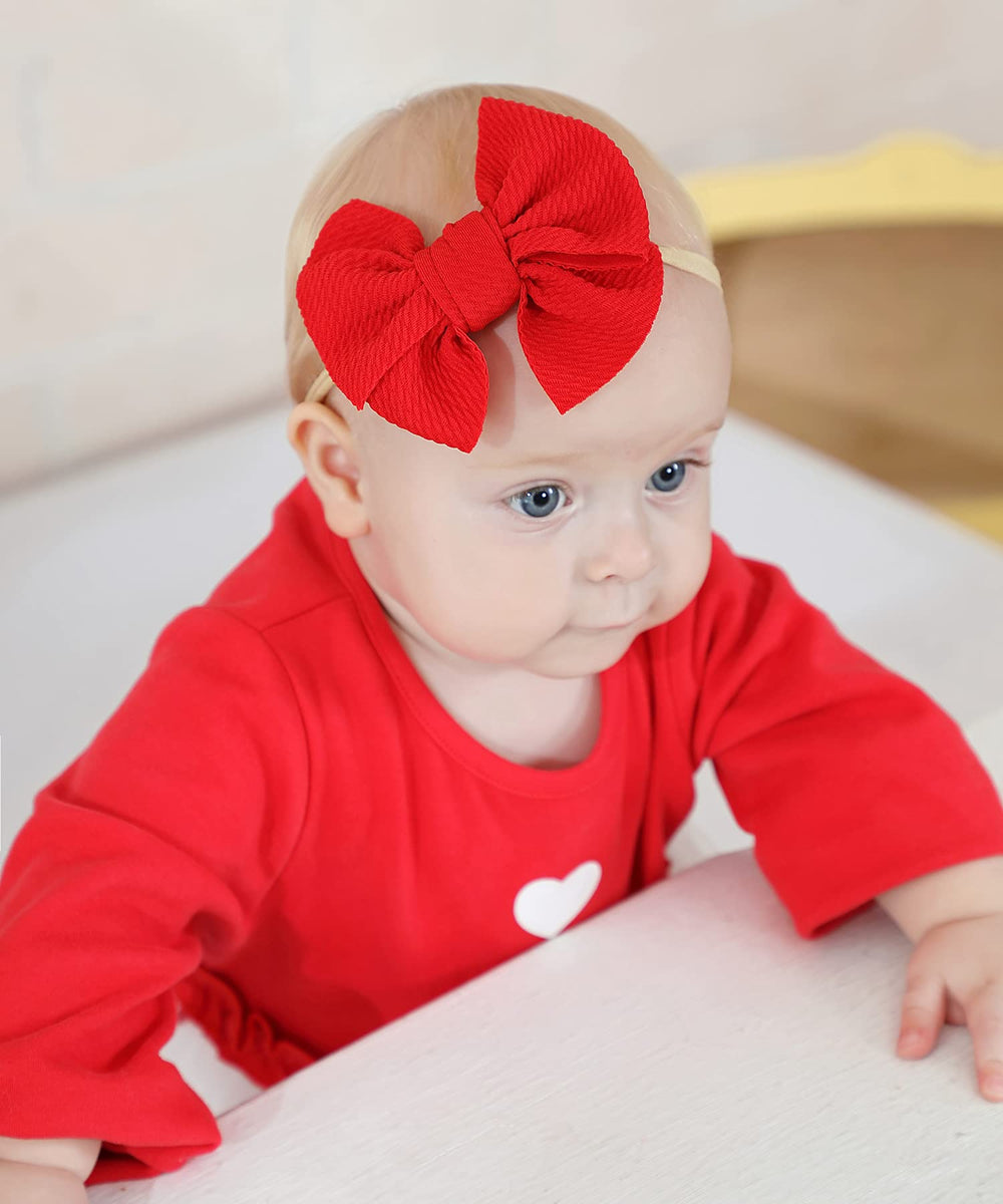 Cinaci headbands bow detail with large dacron bow and soft stretch.