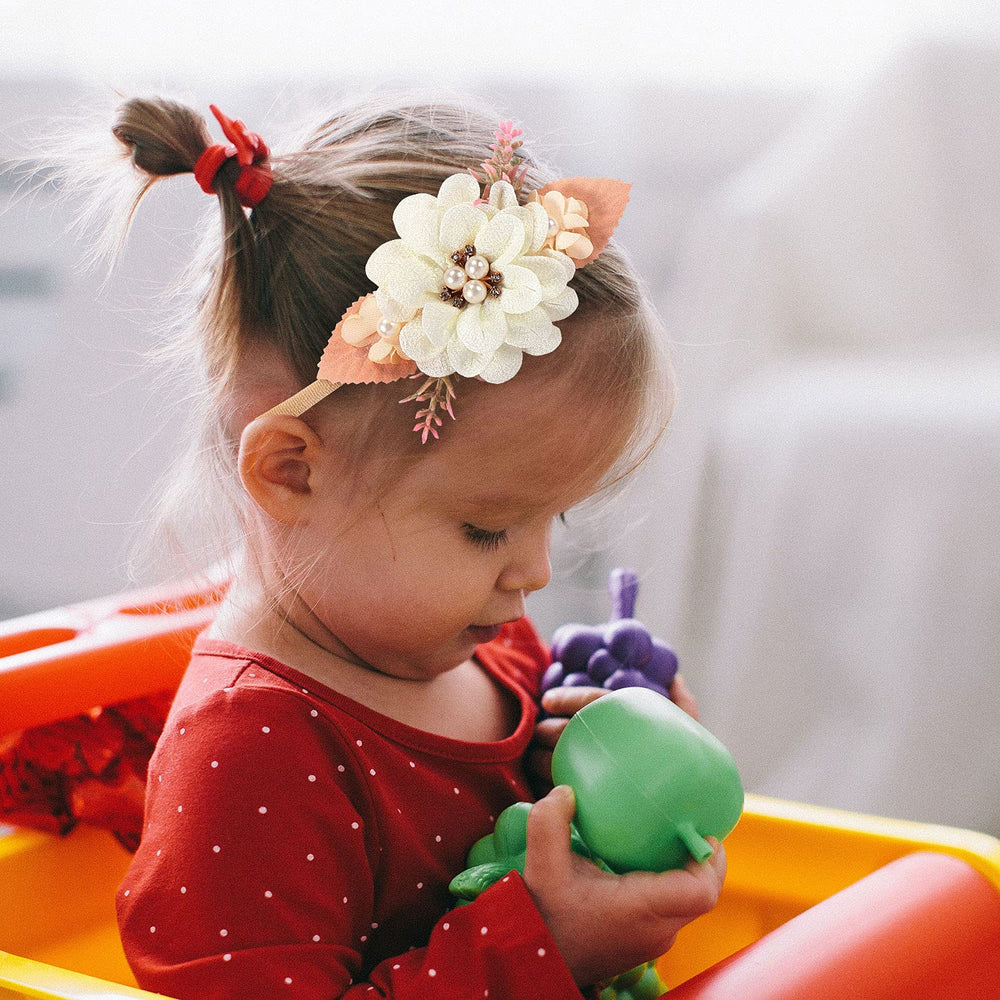 Cinaci one-size floral headbands fit newborns through adults with comfortable stretch.