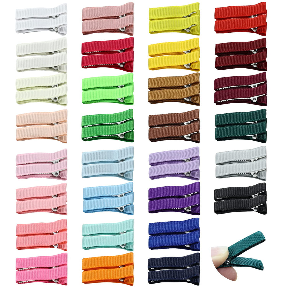 Cinaci small alligator clip in white securely grips fine hair with soft grosgrain finish.