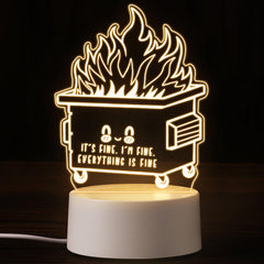 Cinnvoice dumpster fire night light glows warm on a bedside table, creating cozy ambiance.