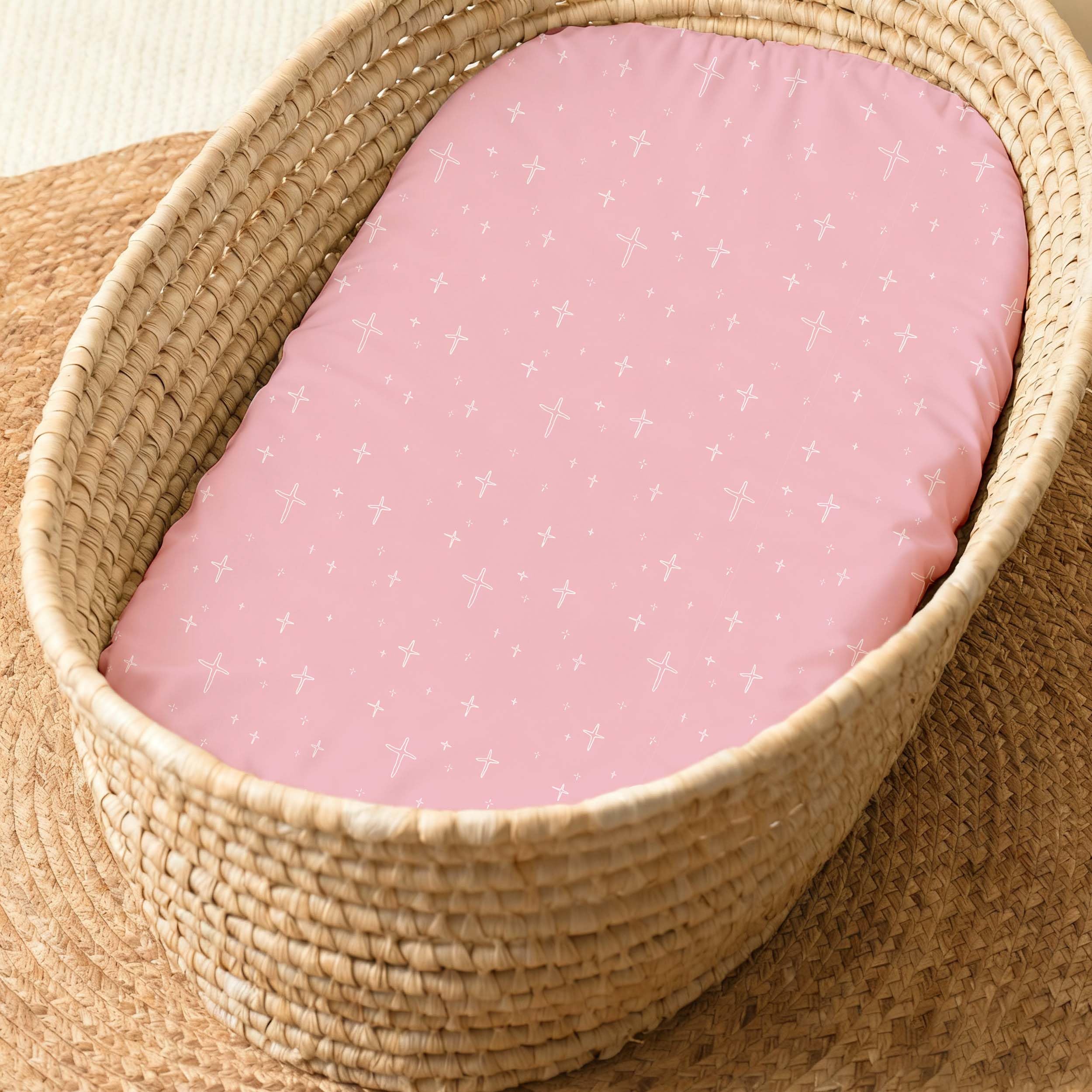 Civarua Kids bassinet sheets in use with baby featuring rainbow pink color