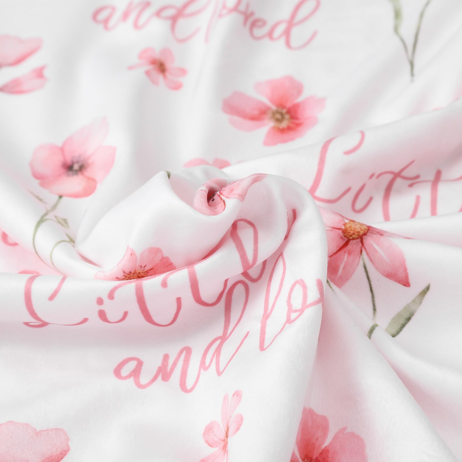 Civarua Kids newborn blanket features soft polka dot fleece backing up close.