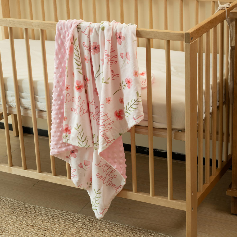 Civarua Kids floral blanket rainbow print displayed in nursery setting for stylish coziness.