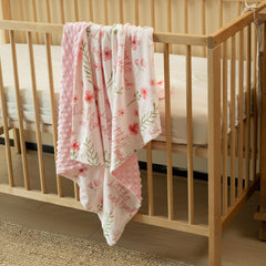 Civarua Kids floral blanket rainbow print displayed in nursery setting for stylish coziness.