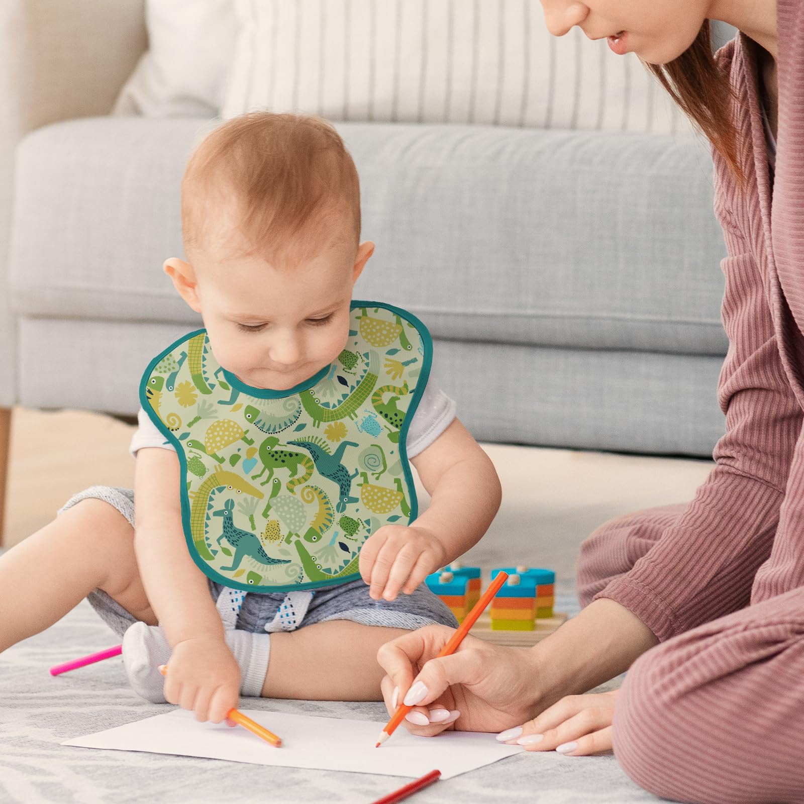 Civarua Kids bib in use during self-feeding for mess control.