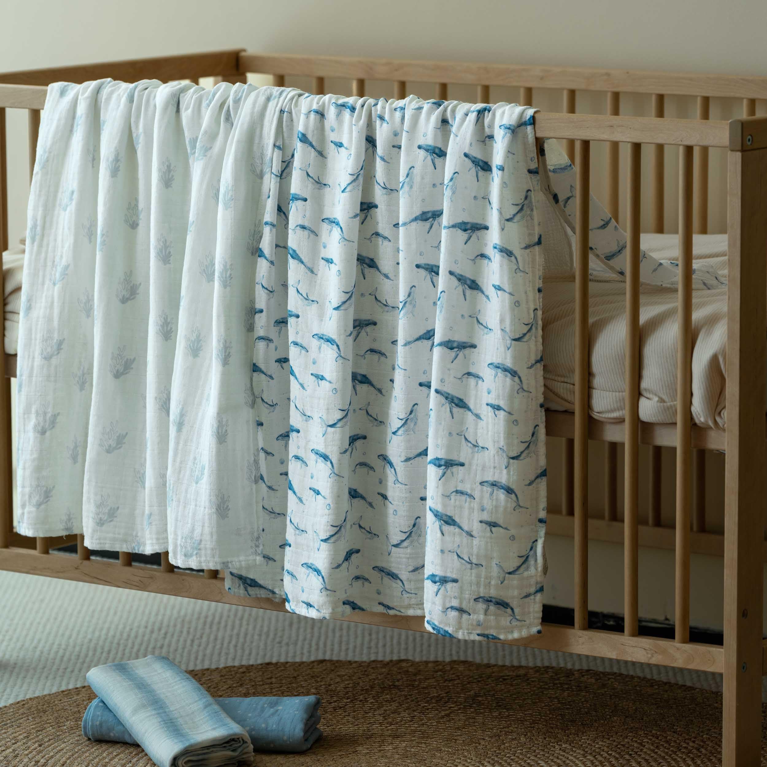 Civarua Kids muslin swaddle blue whale fabric closeup showcases soft airy texture