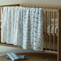 Civarua Kids muslin swaddle blue whale fabric closeup showcases soft airy texture