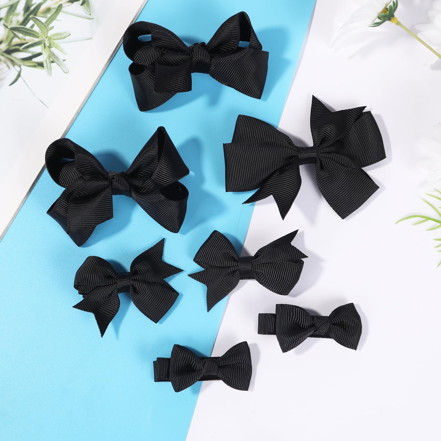 Clipband back-to-school bows in black complete playful outfits.