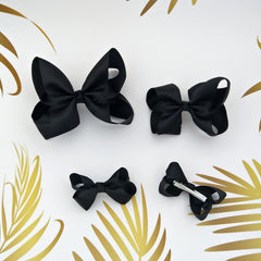 Clipband Black Bows alligator clip closeup demonstrates sturdy grip for busy mornings.