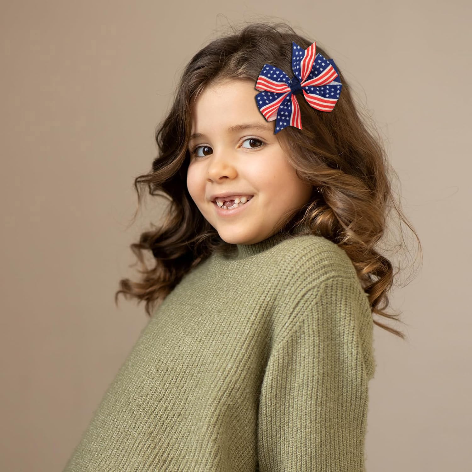 Close-up of Clipband patriotic red, white, and blue bows for vibrant looks.