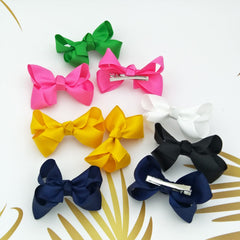 Clipband Green Bows worn in hair demonstrate versatile styling.