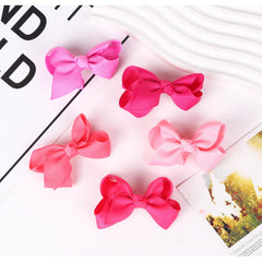Clipband packaging for 10-piece boutique bow set, ideal for gifting