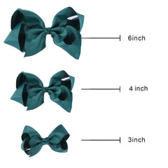 Clipband Hunter Green Bows styled on a child for a cute ponytail look.