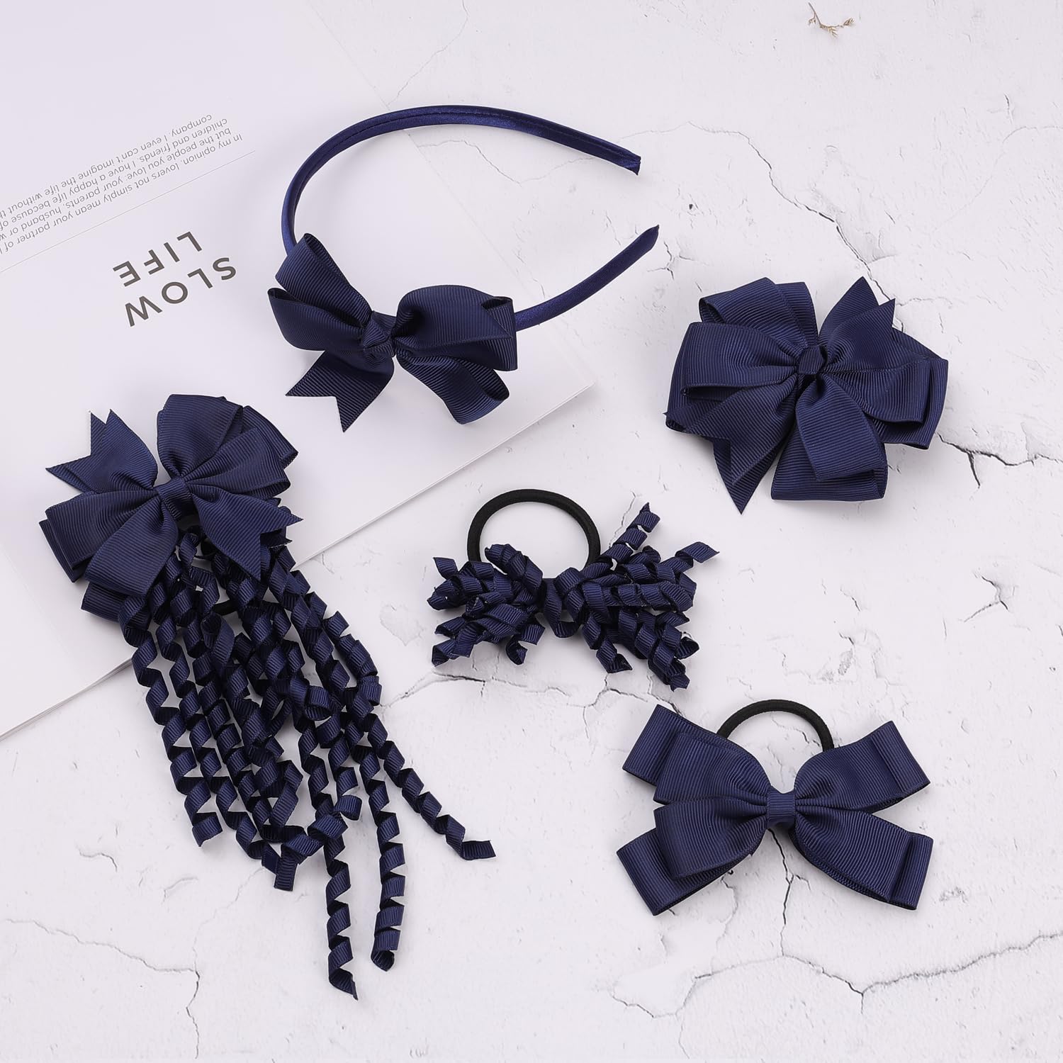 Clipband navy pom-pom hair ties add playful accents and secure holds.