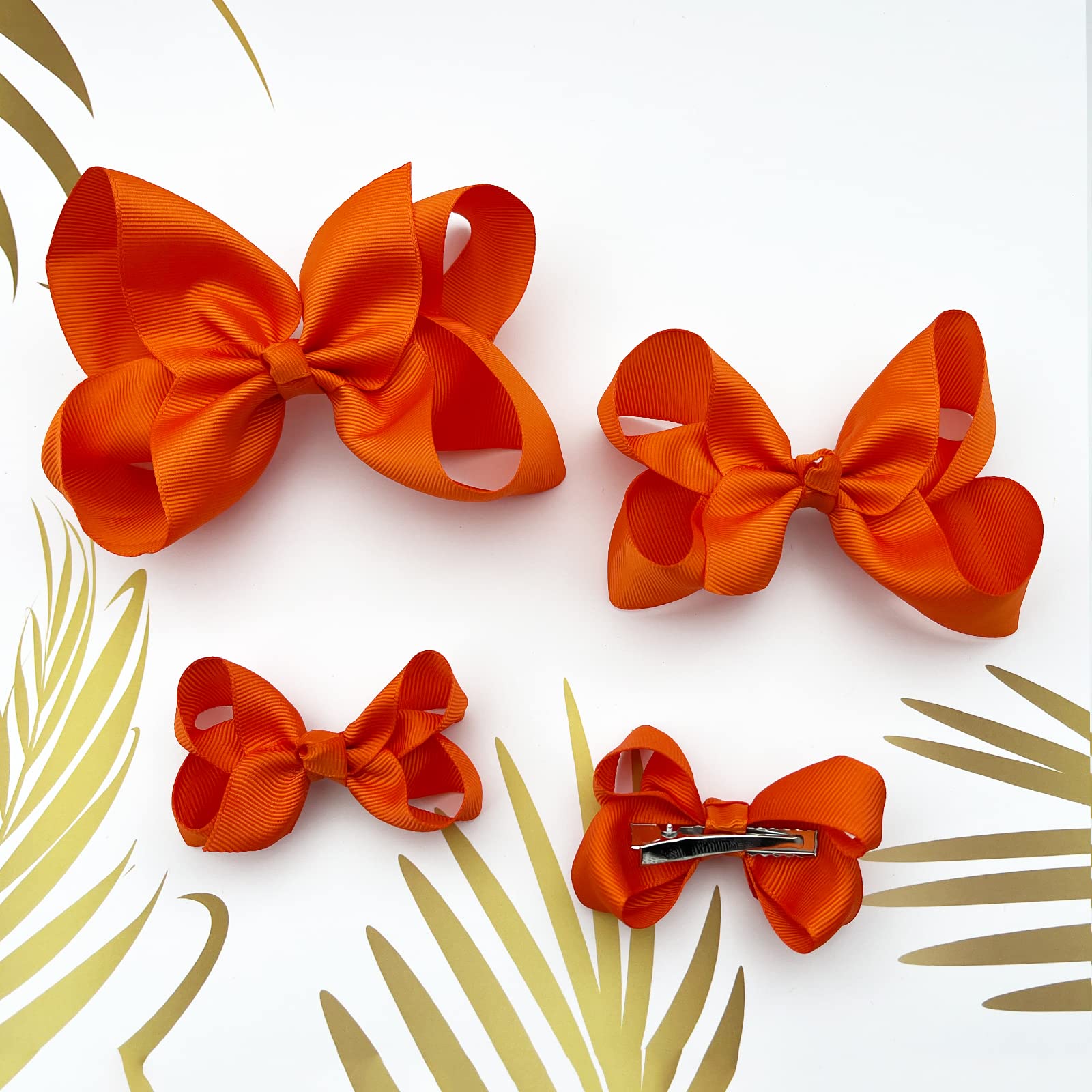 Clipband Orange Bows on ponytail demonstrates easy, comfortable, all-day hold.