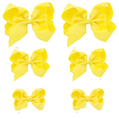 Clipband Yellow Bows 6-pack on white background for vibrant kids’ hairstyles.