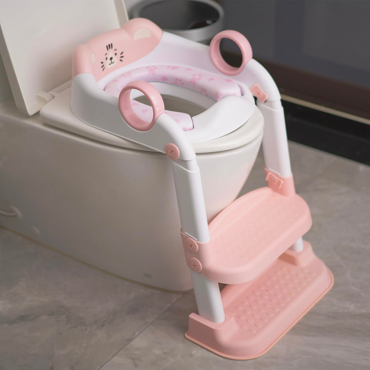 Clock King potty seat pink tiger design engages toddlers during toilet training.
