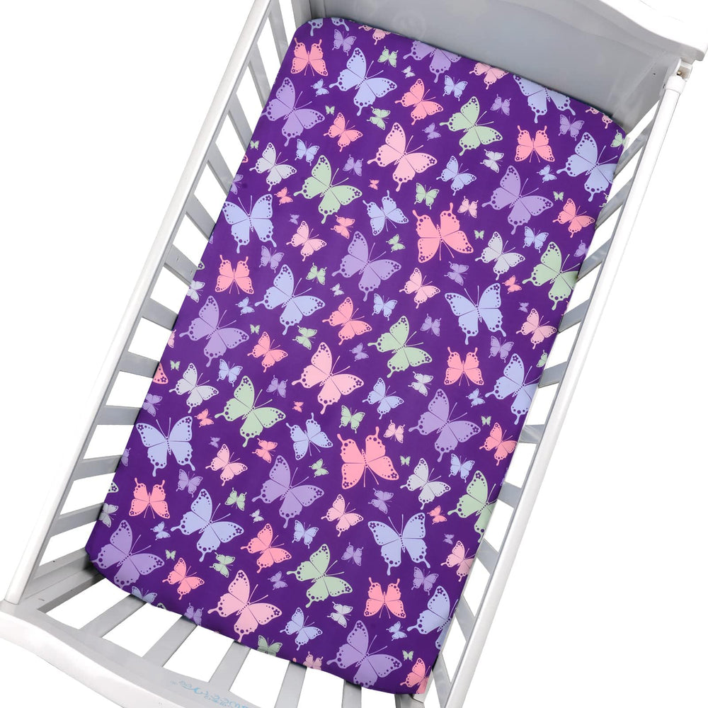 Cloele butterfly pattern on fitted sheet creates cheerful nursery aesthetics and gentle sleep ambience.