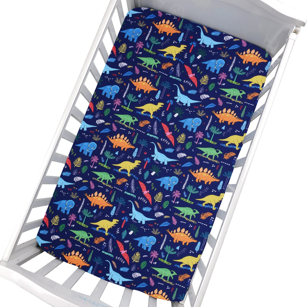 Cloele dinosaur fitted crib sheet fabric closeup shows soft, breathable polyester