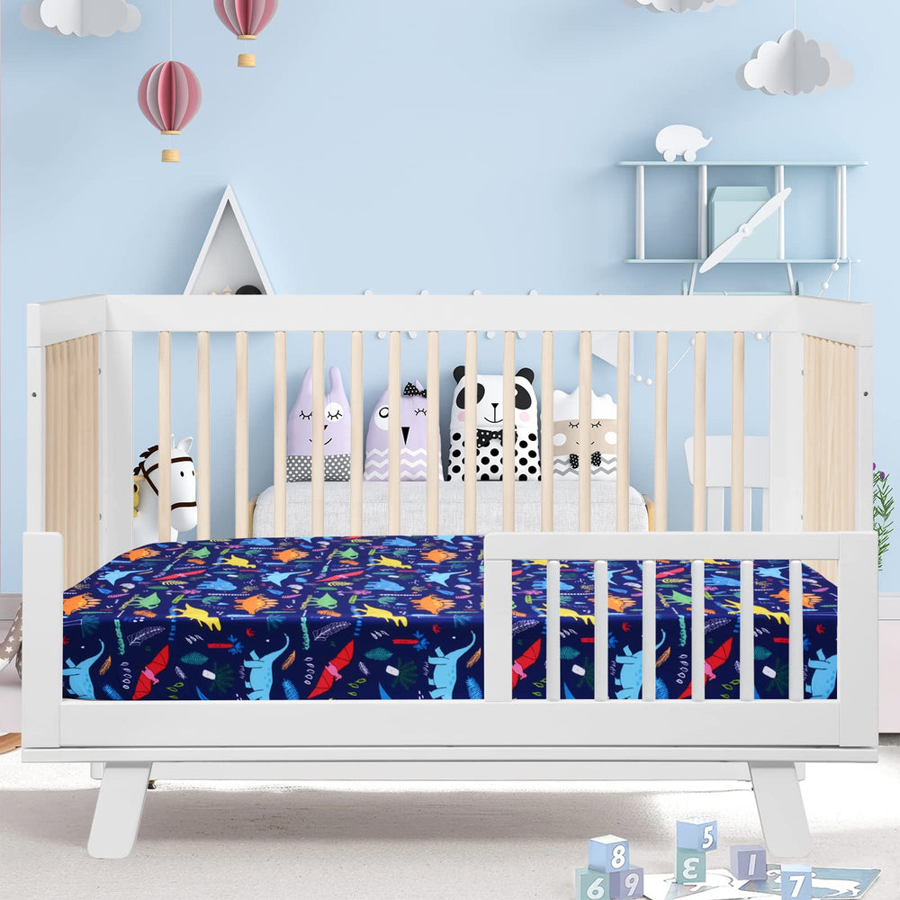 Cloele dinosaur fitted crib sheet on crib demonstrates snug pocket