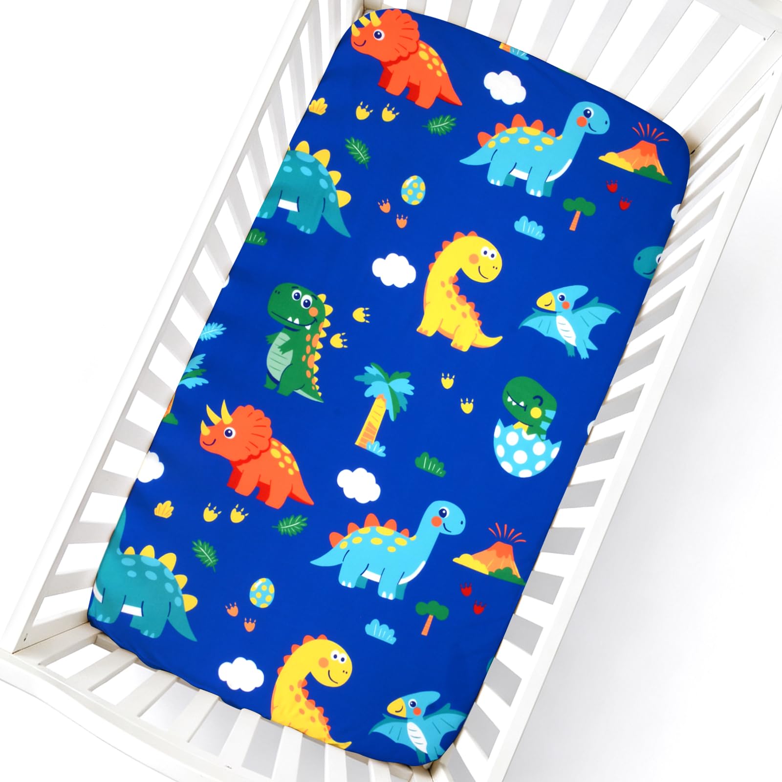 Cloele Dinosaur Fitted Crib Sheet on standard crib mattress providing a snug, secure fit.