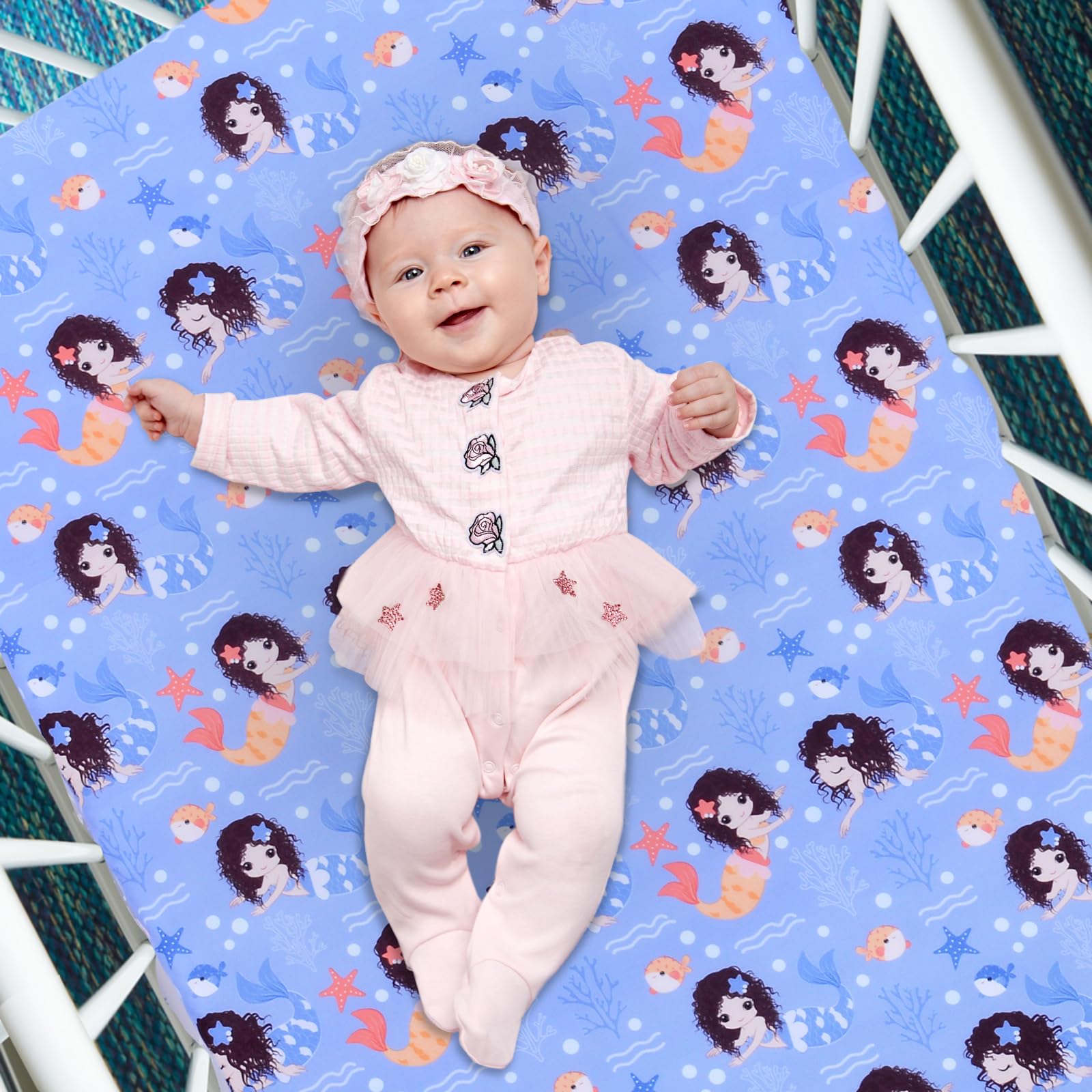 Cloele Mermaid crib sheet fitted snugly on a standard crib mattress for secure sleep.