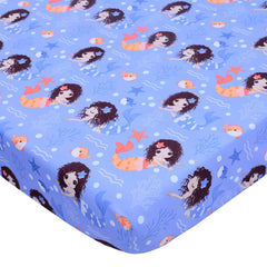 Cloele Mermaid crib sheet folded on a crib, adding playful purple nursery decor.