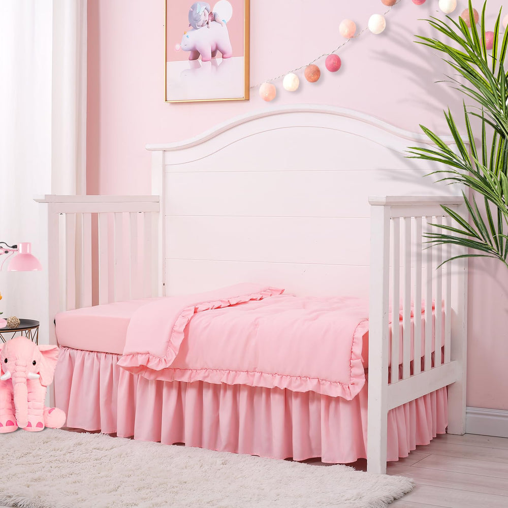 Cloele quilted comforter pink 33x42 with a 2-inch ruffle for cuddly warmth.