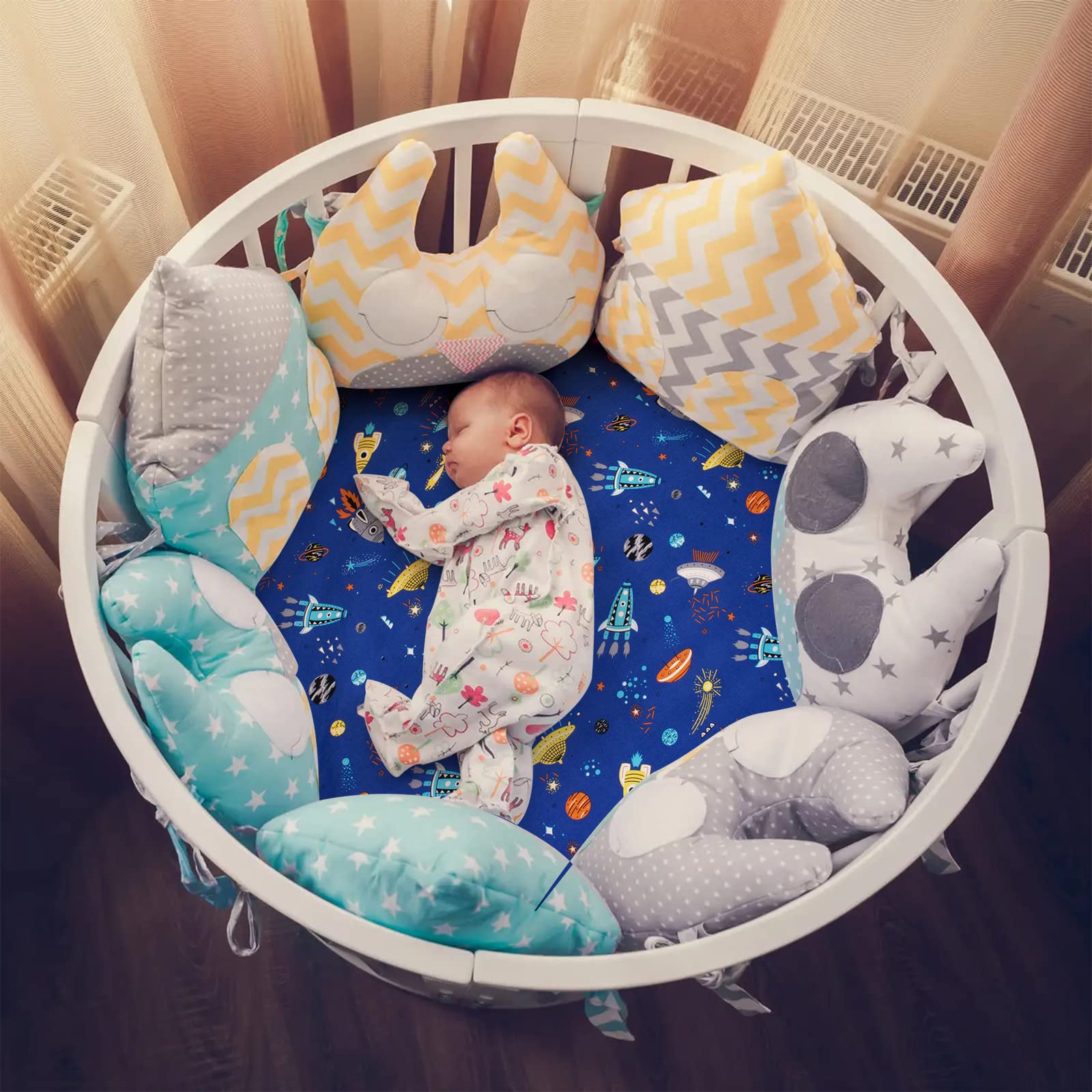 Cloele round crib sheet 360-wrap showcases secure fit during playtime.