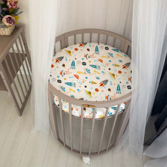 Cloele round stretchy crib sheet baby-in-crib demonstrates cozy surface