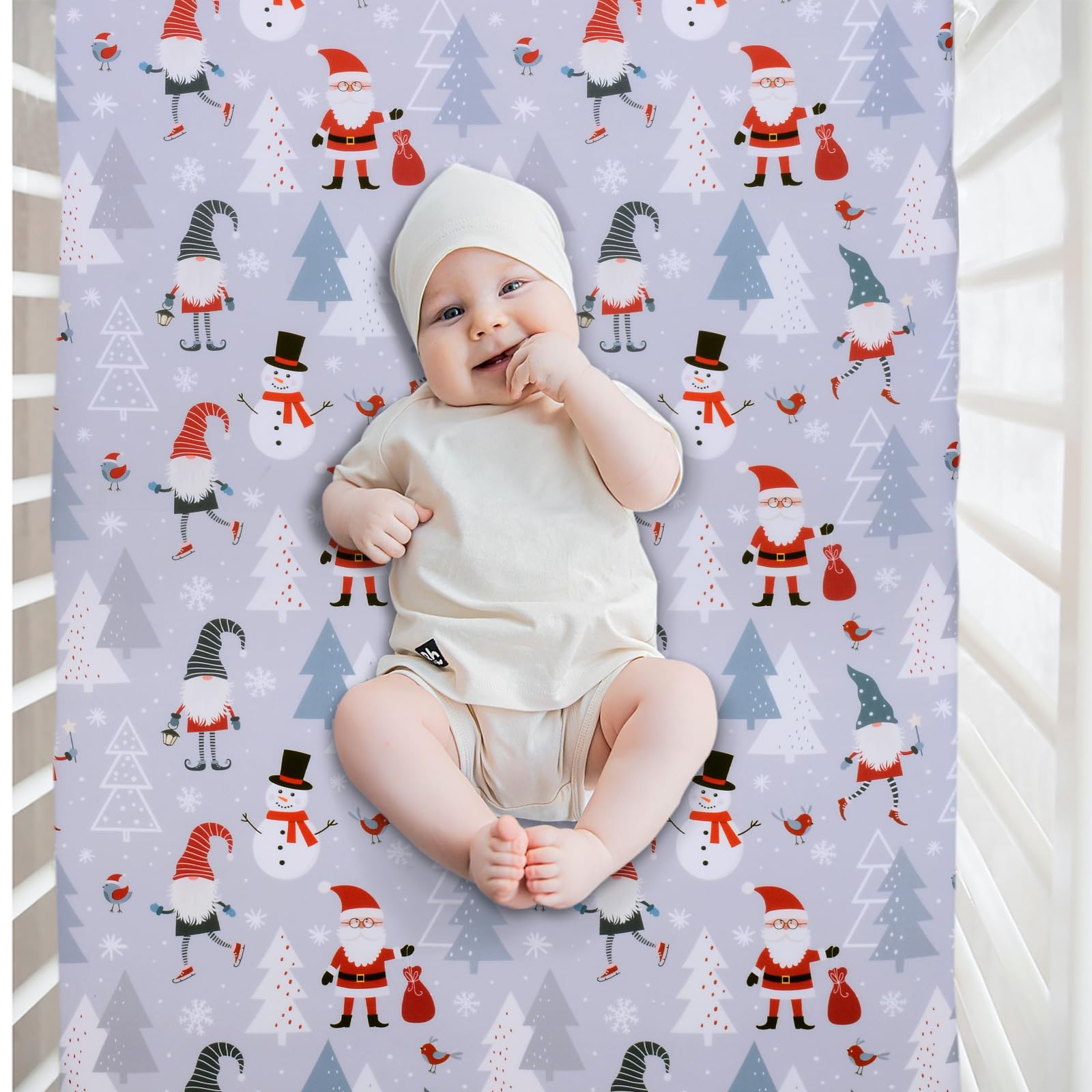 Cloele Snowman grey fitted crib sheet on bed showing cozy fit