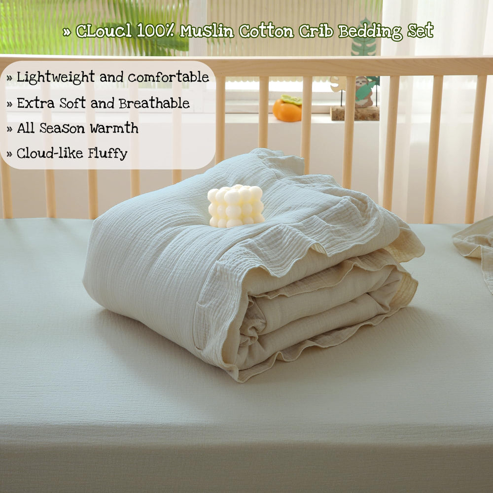 CLoucl gray crib bedding in a stylish nursery