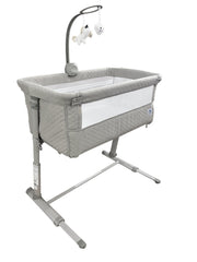 Cloud Baby Bedside Bassinet features hanging figurine and music for soothing nights.