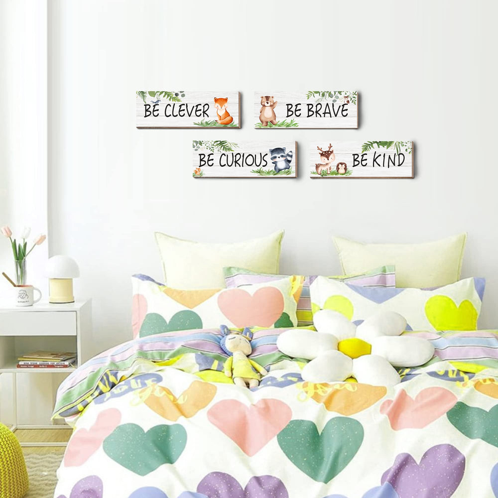 CloverKoi safari wall decor 4-piece set creates cohesive jungle-themed space.
