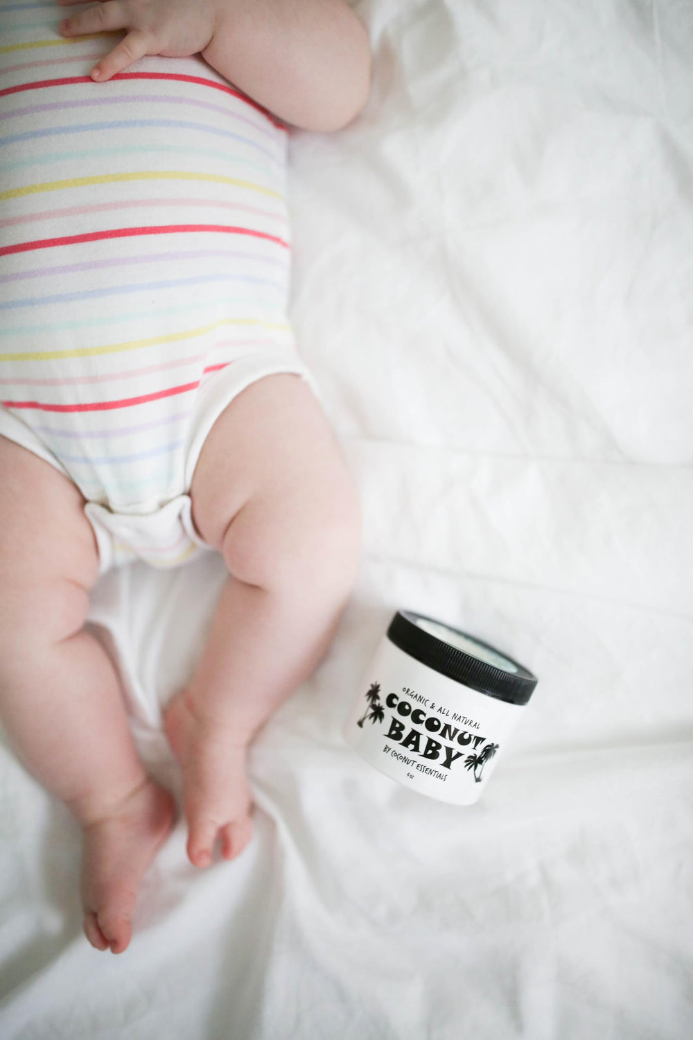 Coconut Essentials coconut baby oil family use shot shows versatile care
