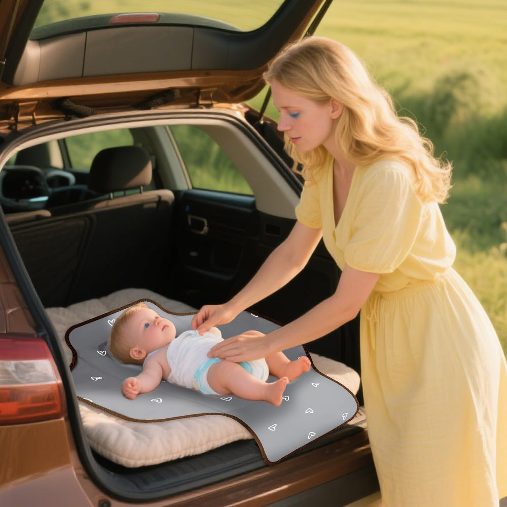 Coinarin baby-changing mat is ready to slip into a diaper bag on outings.