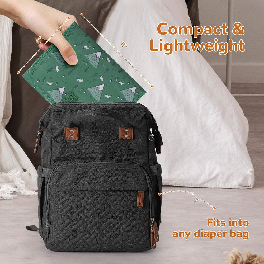 Coinarin Portable Changing Pad folded in bag showing ultra-compact travel-ready design.