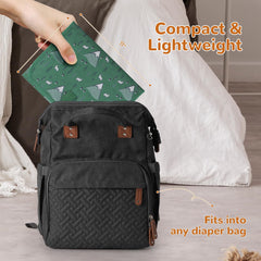 Coinarin Portable Changing Pad folded in bag showing ultra-compact travel-ready design.