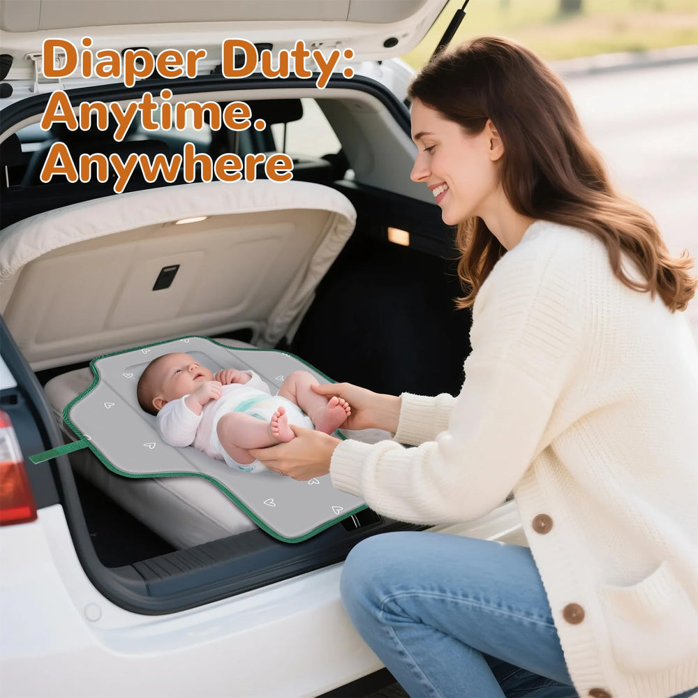Coinarin Portable Changing Pad travel setup demonstrates lightweight one-handed use.