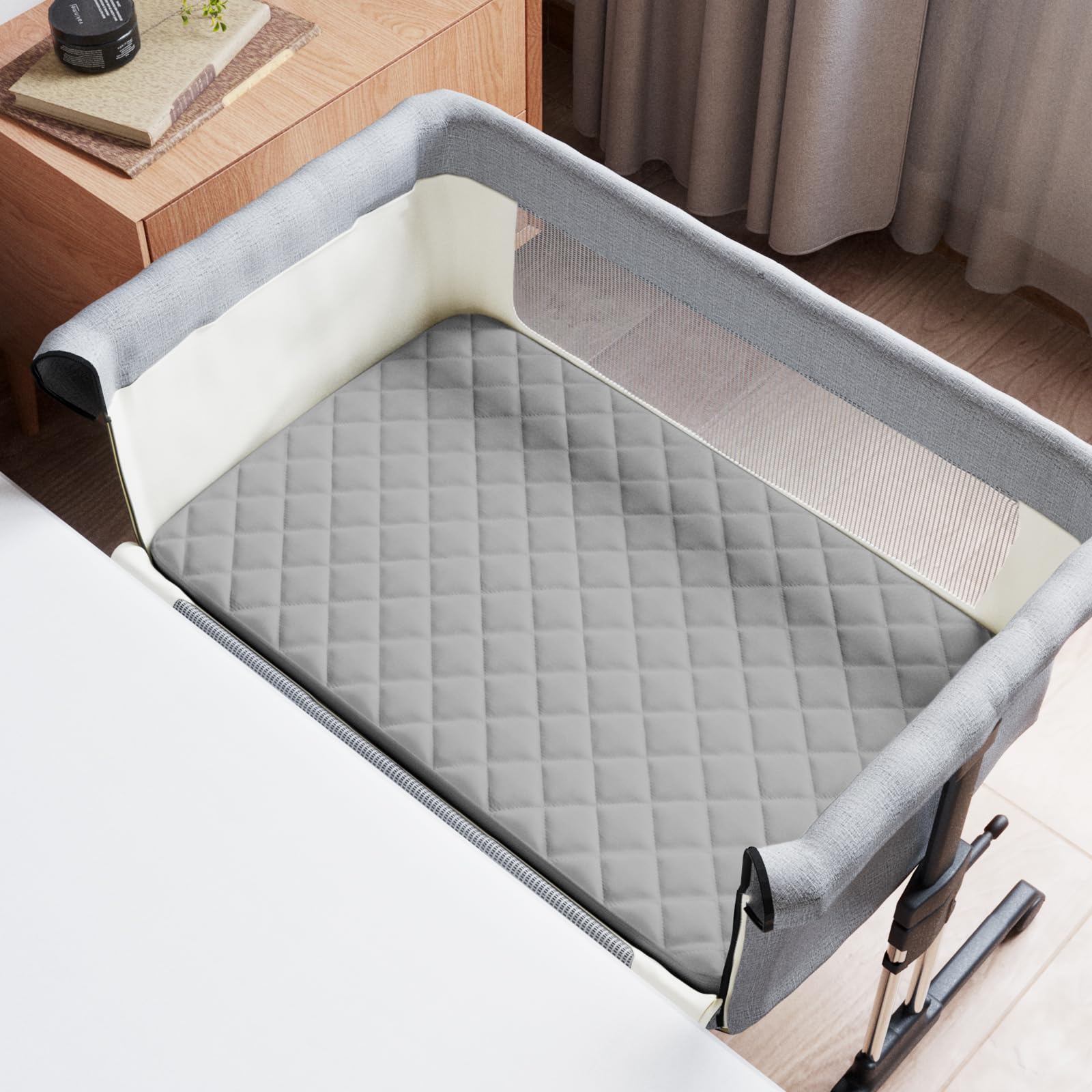 Coldwind bassinet pad cover waterproof TPU layer shields mattress from spills.