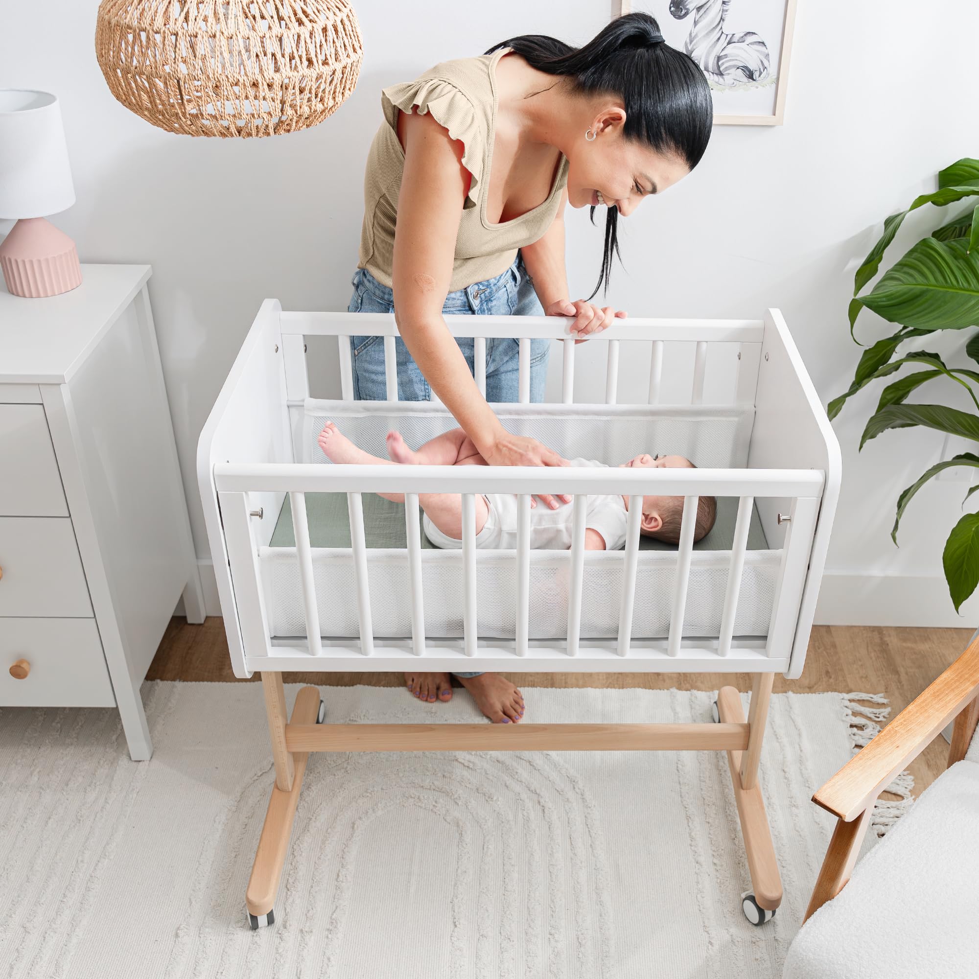 Comfy Cubs wooden bedside bassinet adds elegant nursery style.