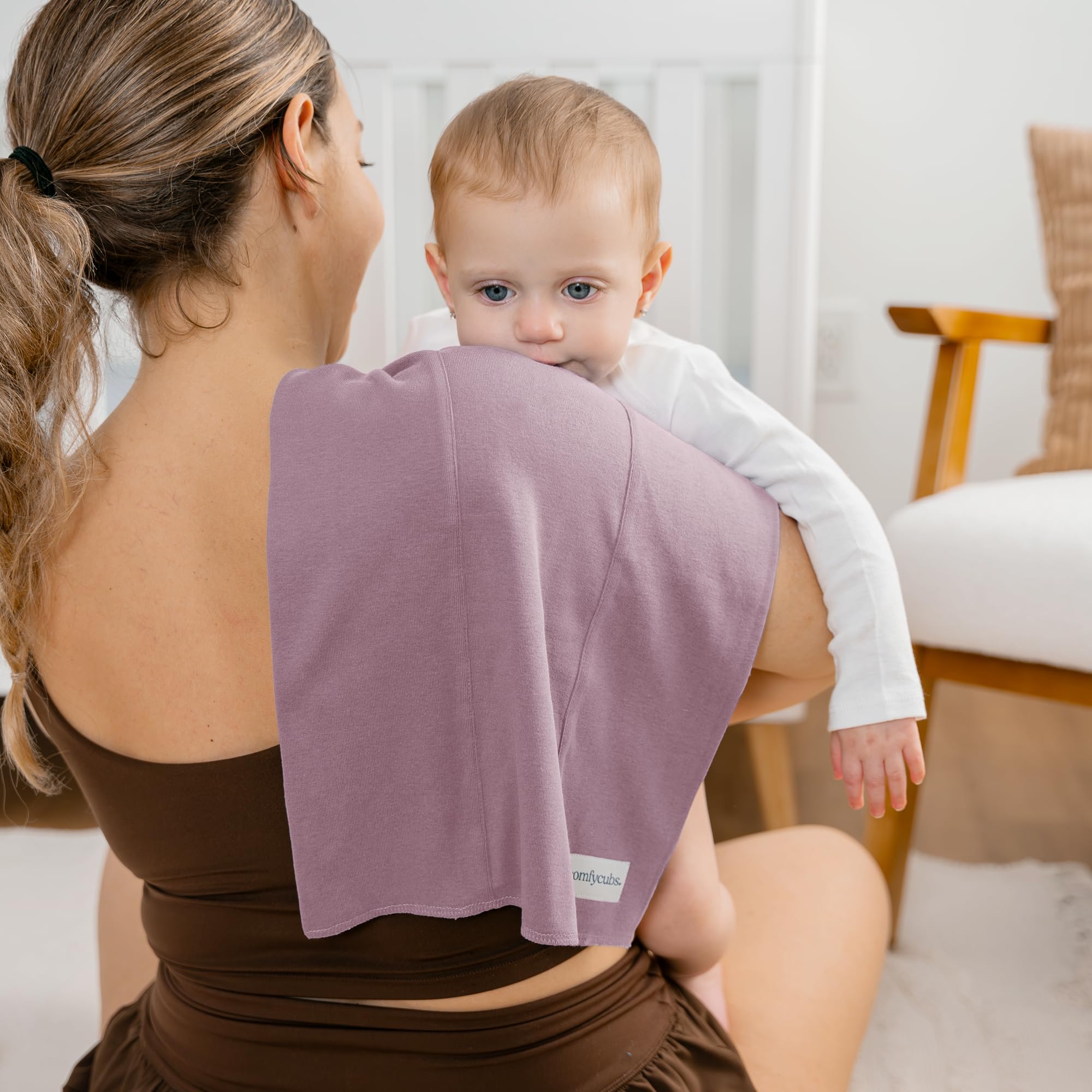 Comfy Cubs baby burp cloths showing 16x12-inch coverage over shoulder.