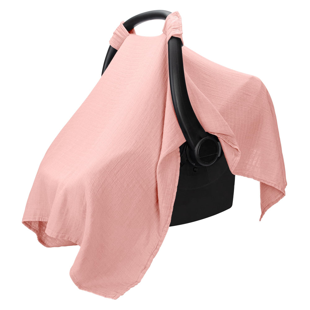 Comfy Cubs car seat cover fabric close-up shows soft rayon-muslin blend for baby comfort.