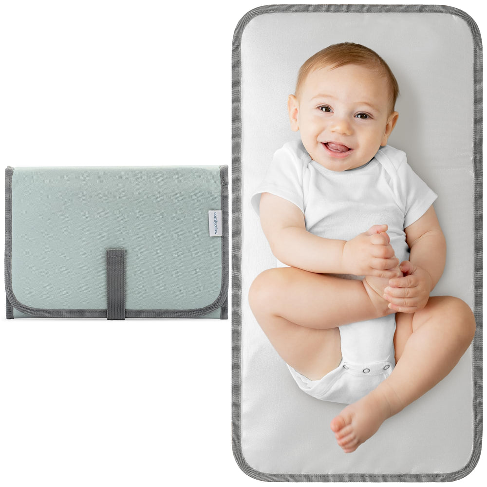 Comfy Cubs changing pad compact folded clutch for easy on-the-go diaper changes.