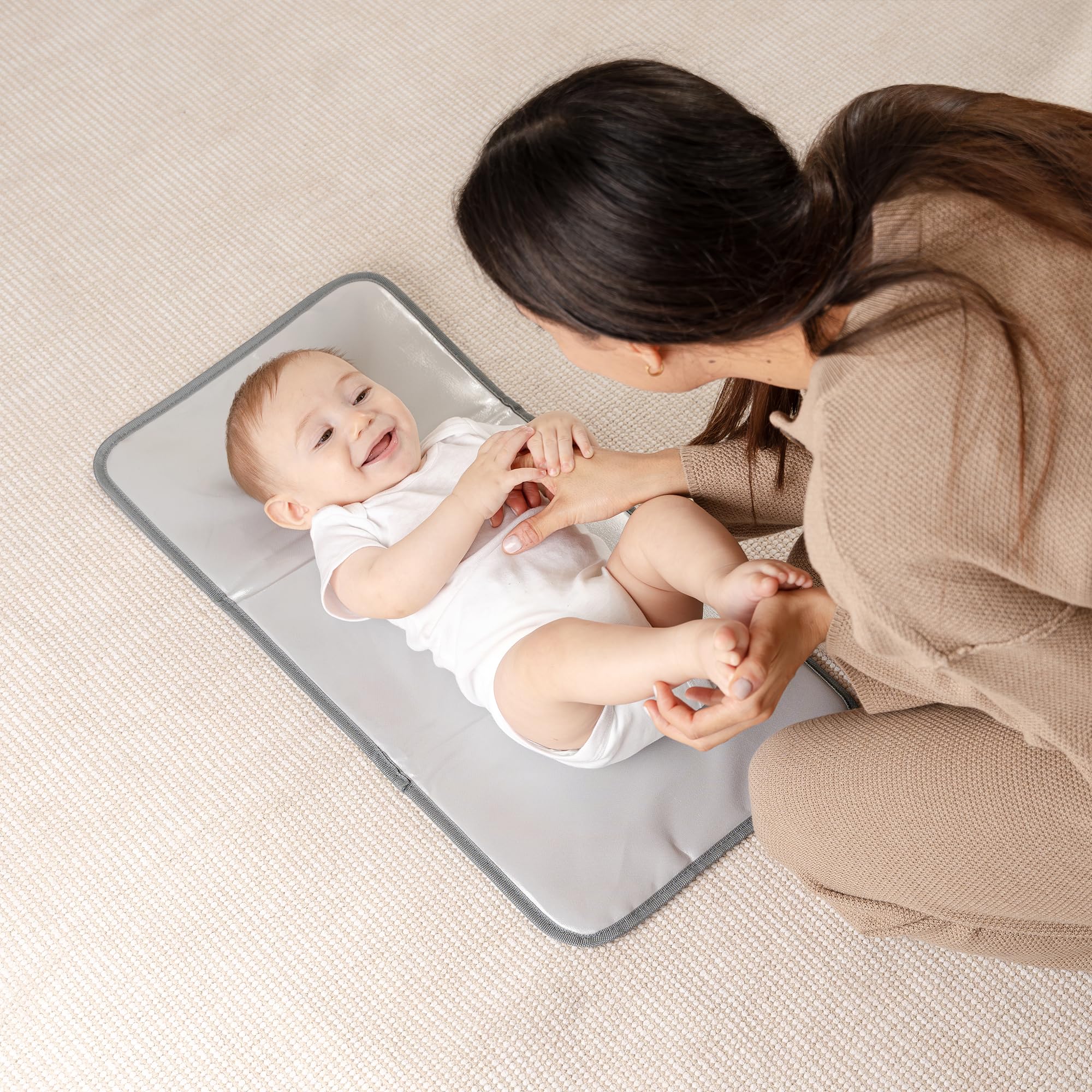 Comfy Cubs changing pad waterproof surface for quick wipe-clean changes.