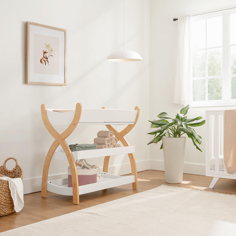 Comfy Cubs changing table open shelves keep nappies and wipes within easy reach.