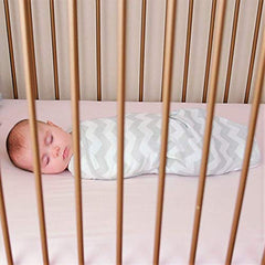 Comfy Cubs Easy Swaddle Blanket in nursery scene shows soft cotton for comfortable sleep.