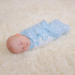 Comfy Cubs Easy Swaddle Blanket blue on baby promotes restful sleep with breathable cotton.