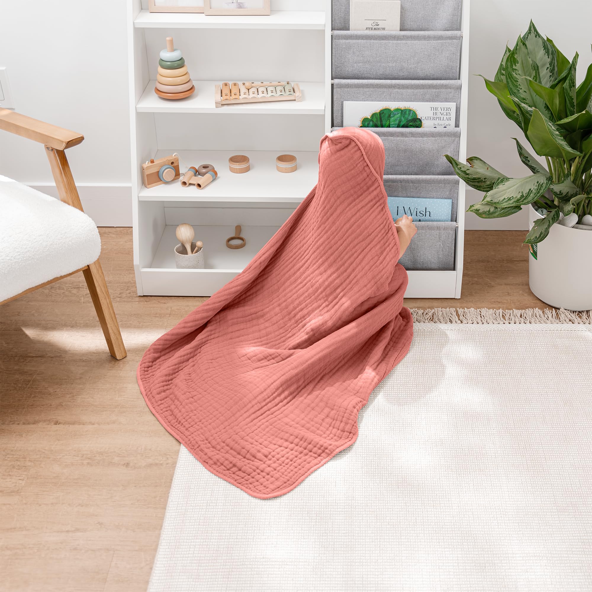 Comfy Cubs hooded towel shows 6-layer muslin weave for lasting softness.
