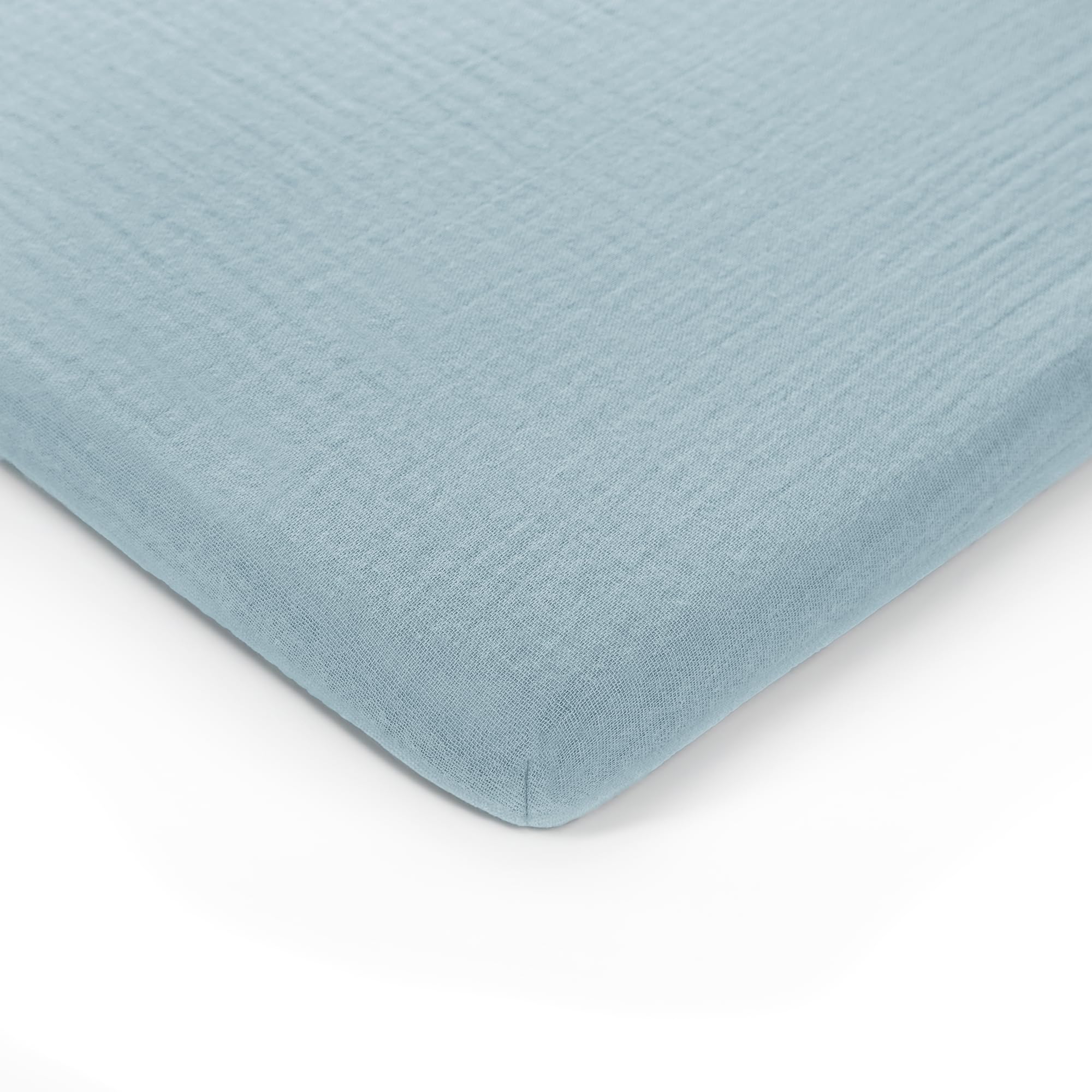 Comfy Cubs muslin bassinet sheet fold — portable softness for on-the-go naps.